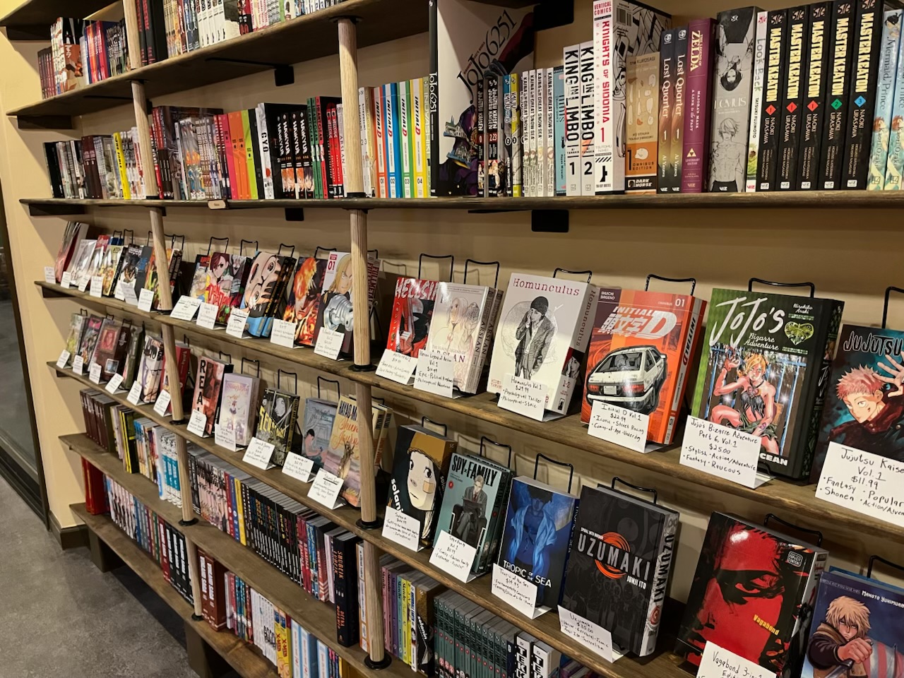 Bookshelves full of mang and graphic novels.