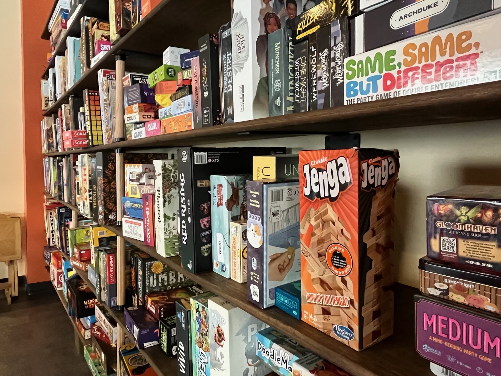Bookshelves full of board games.