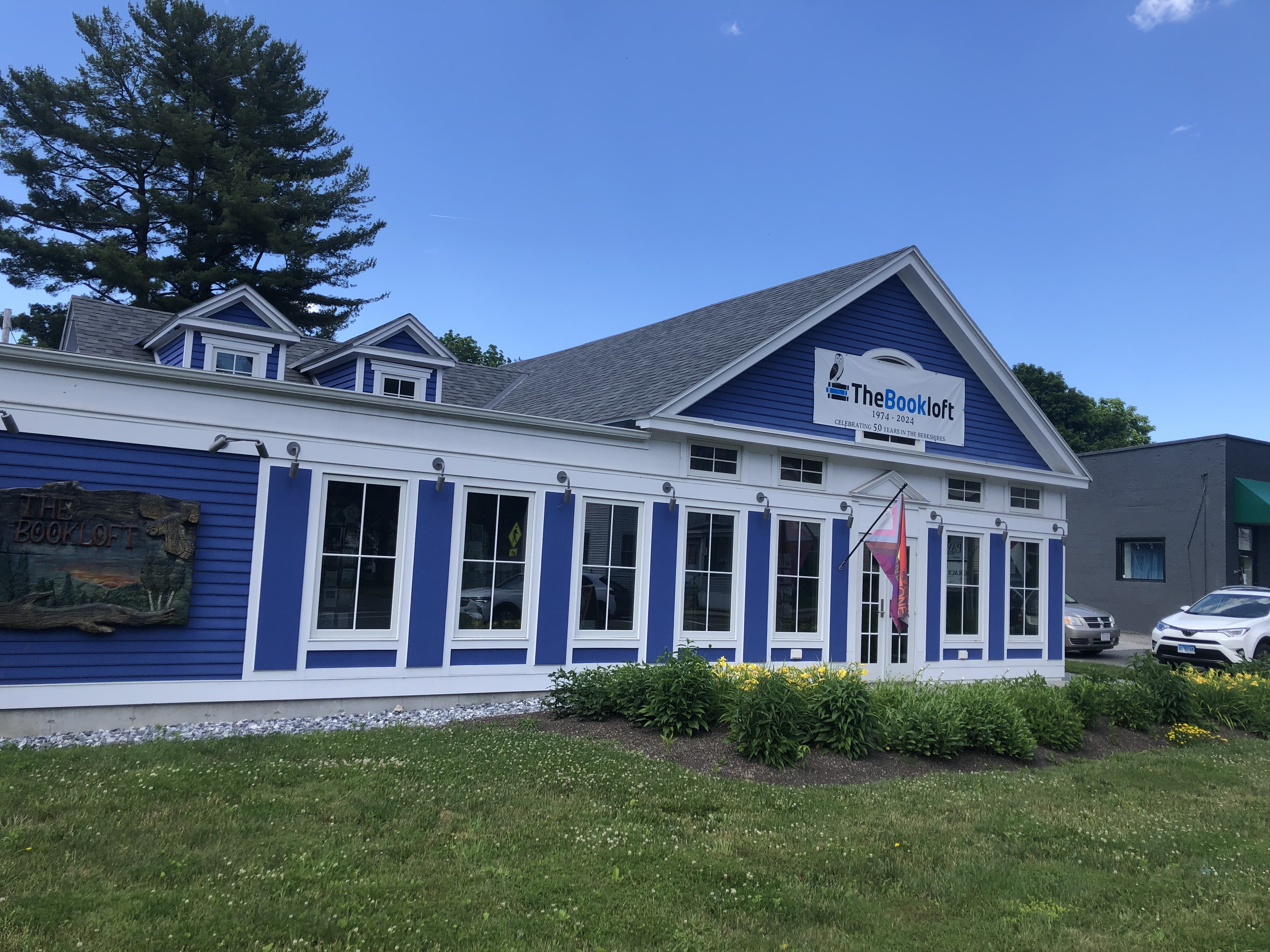 Exterior view of The Bookloft, a blue house with white trim.